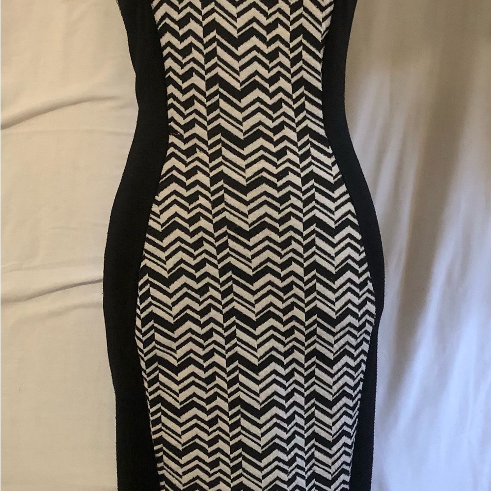 Black/white knee length form fitting dress. French Atmosphere, slip on.
